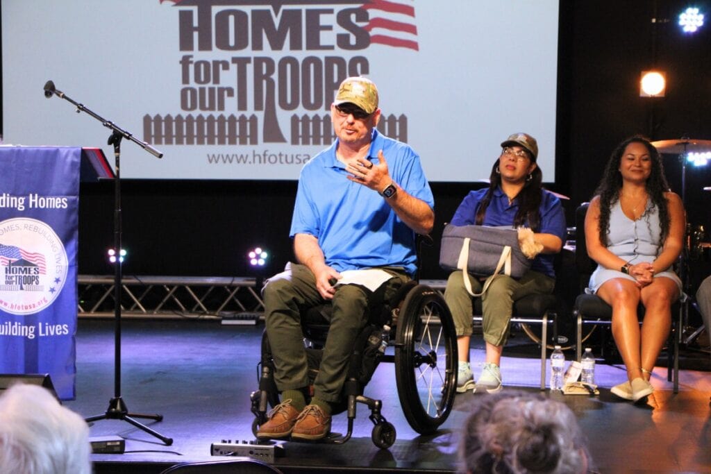 Carlos Rivera shares his story on stage at Canvas Church. Photo by Lillian Hamman