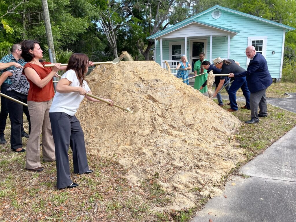 Gainesville staff and elected representatives for the city and county break ground on the new housing project. Photo by Seth Johnson