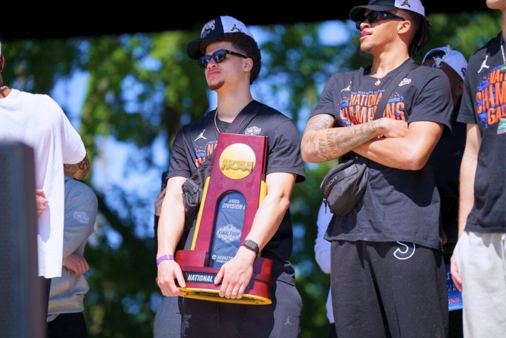The Final Four's Most Outstanding Player William Clayton Jr. holds the NCAA Tournament championship trophy at UF's Welcome Home Rally on Tuesday. Photo by Tim Rodriquez
