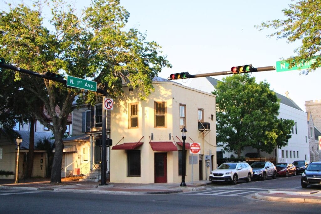The Holy Trinity Episcopal Foundation's block with the former Modern Shoe Repair facade facing the corner. Photo by Lillian Hamman