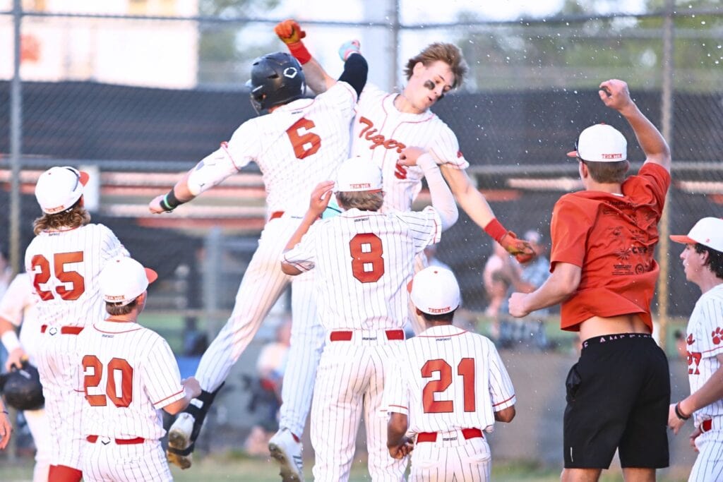 Trenton's Ty Moses (5) celebrates with his teammates after hitting a three-run home run in the third inning against Chiefland in game two of the Rural Region 4 Semifinals. Photo by C.J. Gish