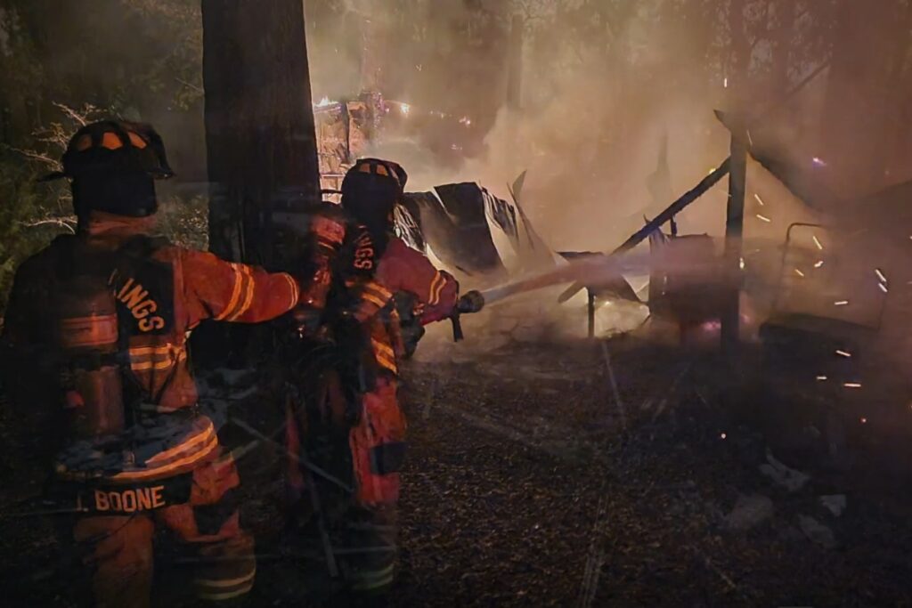High Springs Fire Department personnel work to extinguish the last of the flames.