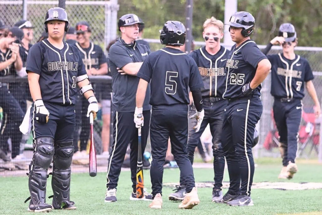 Buchholz assistant coach Chris Malphurs talks strategy during a fourth-inning timeout against Pace in game two of the 6A Region 1 Final. Photo by C.J. Gish