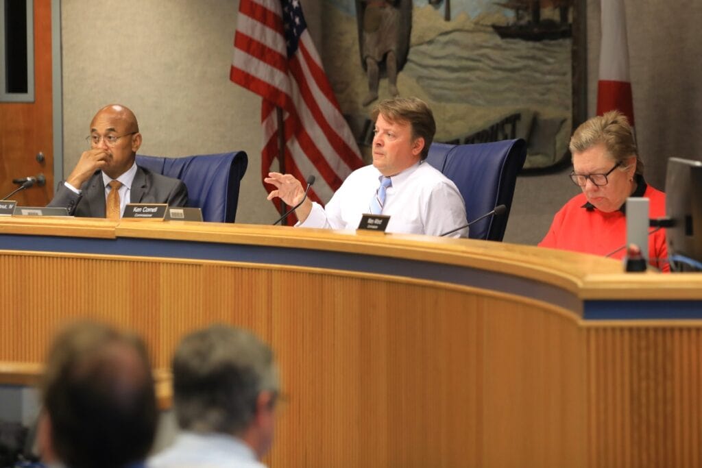 County Commissioner Ken Cornell speaks at the May 27, 2025, meeting, with Commissioner Mary Alford, right, and Chair Chuck Chestnut.