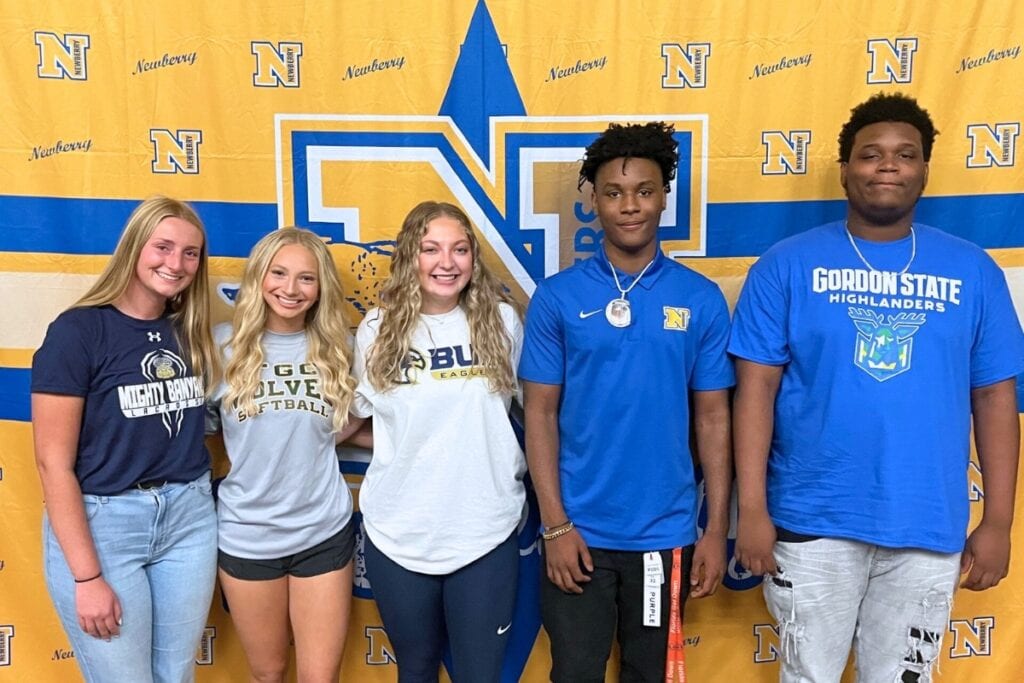 (From left) Newberry's Anna Grace Bennett, Malana Kennard, Sarah Priester, Jacob Green and Amiri Legette signed to play at the college level on Tuesday. Photo by Mike Ridaught