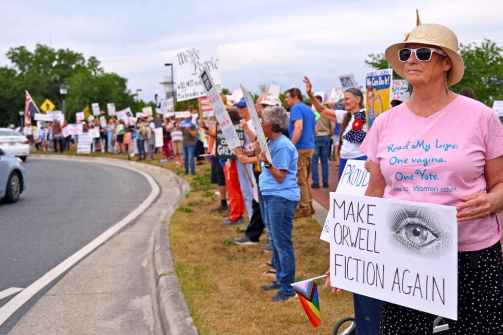 Hundreds of protesters gathered at the intersection of SW Main Street and Depot Avenue on Thursday to protest the Trump administration on International Workers' Day. Photo by Lee Ann Anderson