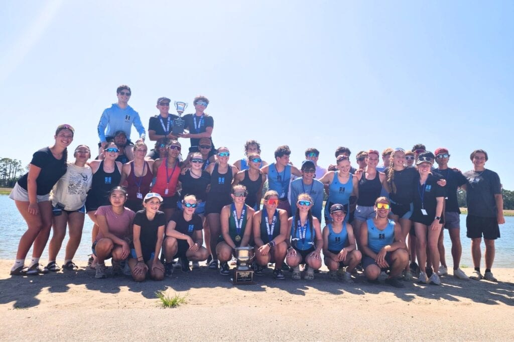 The 2024-2025 Gainesville Area Rowing High School team with coaches and trophies from Sweep States 2025.