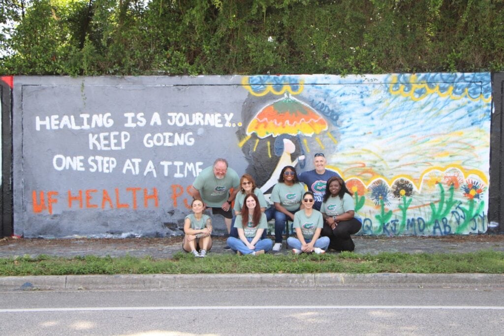 UF Health Psychiatric Hospital muralists complete 'Walking Through the Storm' for National Mental Health Awareness Month. Photo by Lillian Hamman
