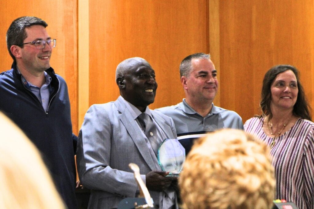 UF Innovate's Elliott Welker (left) and Karl LaPan (right) present Alachua Mayor Walter Welch (center) and the City Commission with the ESO of the Year for rural award. Photo by Lillian Hamman (1)