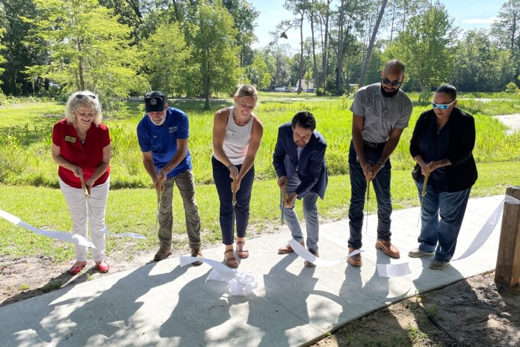 Officials cut the ribbon for the new improvements at Duval Nature Park.
