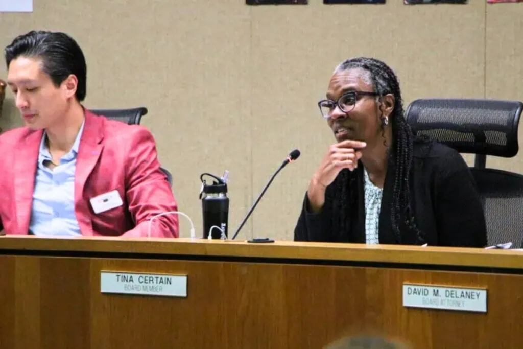 Board members Thomas Vu (left) and Tina Certain and the rest of the School Board of Alachua County considered a 40-item agenda at their meeting on June 3. Photo by Lillian Hamman.