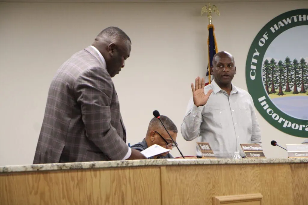 Commissioner Randy Martin (right) is sworn into Seat 2 at the Hawthorne City Commission meeting on June 17. Photo by Lillian Hamman