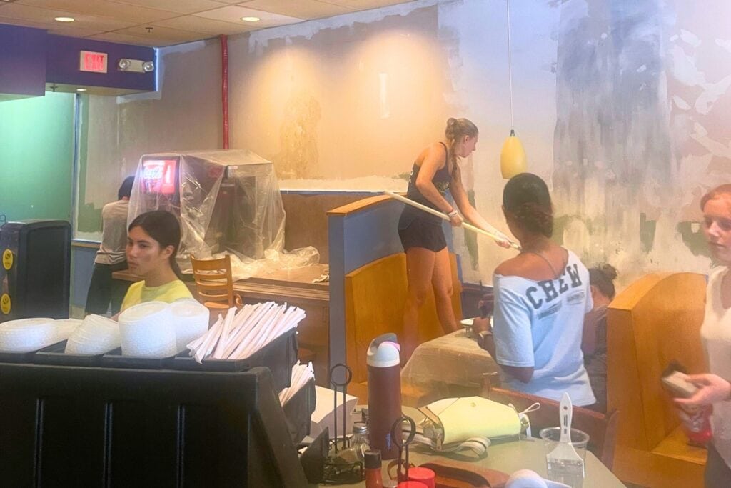 GAR crews work together to re-paint The Bagel Bakery. Courtesy of Jason Cole