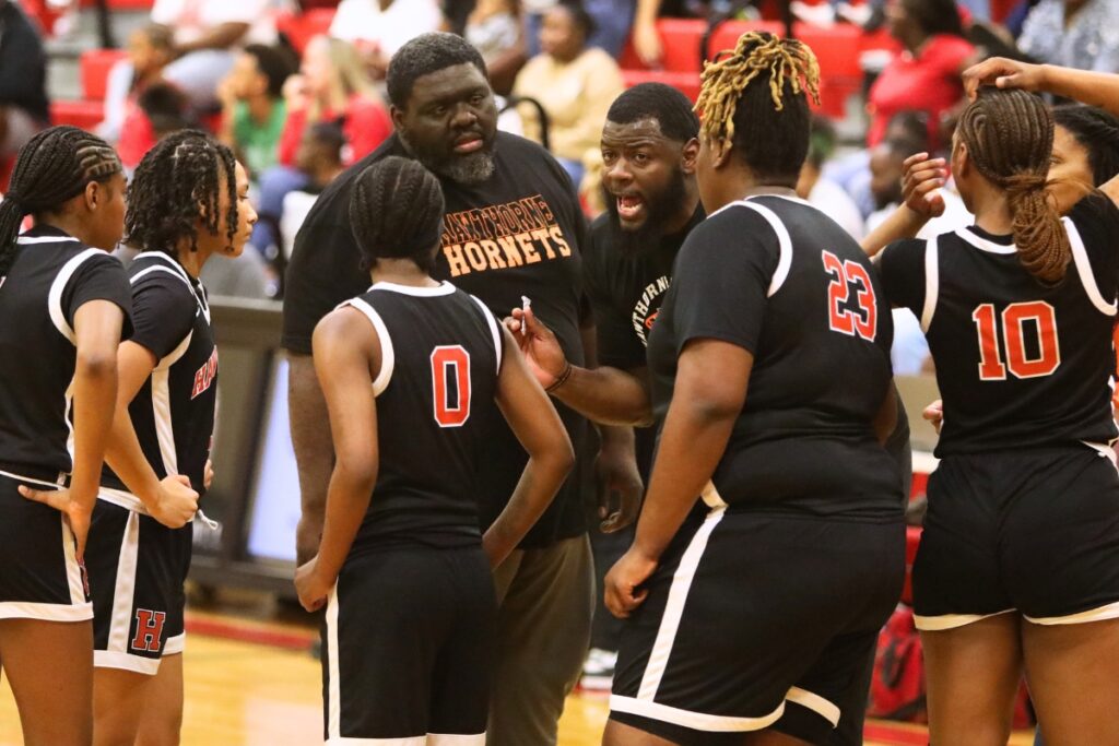 Hawthorne girls basketball coach Cornelius Ingram (talking) stepped down last week after coaching the Hornets to three state championships over eight seasons. Photo by C.J. Gish