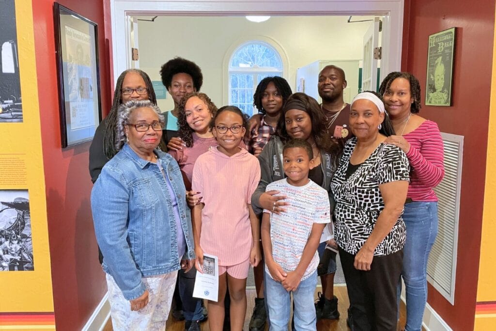 A group photo of Tatanya Peterson (second from right) with her mom, kids, grandkids and cousin at the Matheson Museum for her Reclaiming Kin presentation. Courtesy of Tatanya Peterson 1