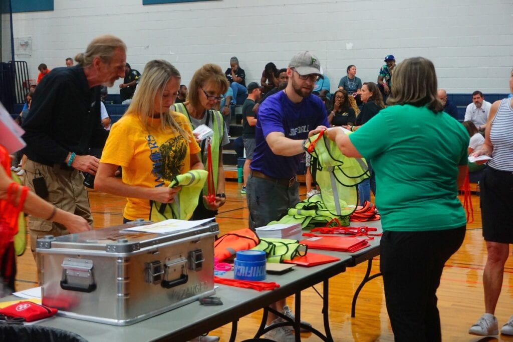 ACPS staff coordinate at a reunification drill ahead of the 2025-2026 school year.