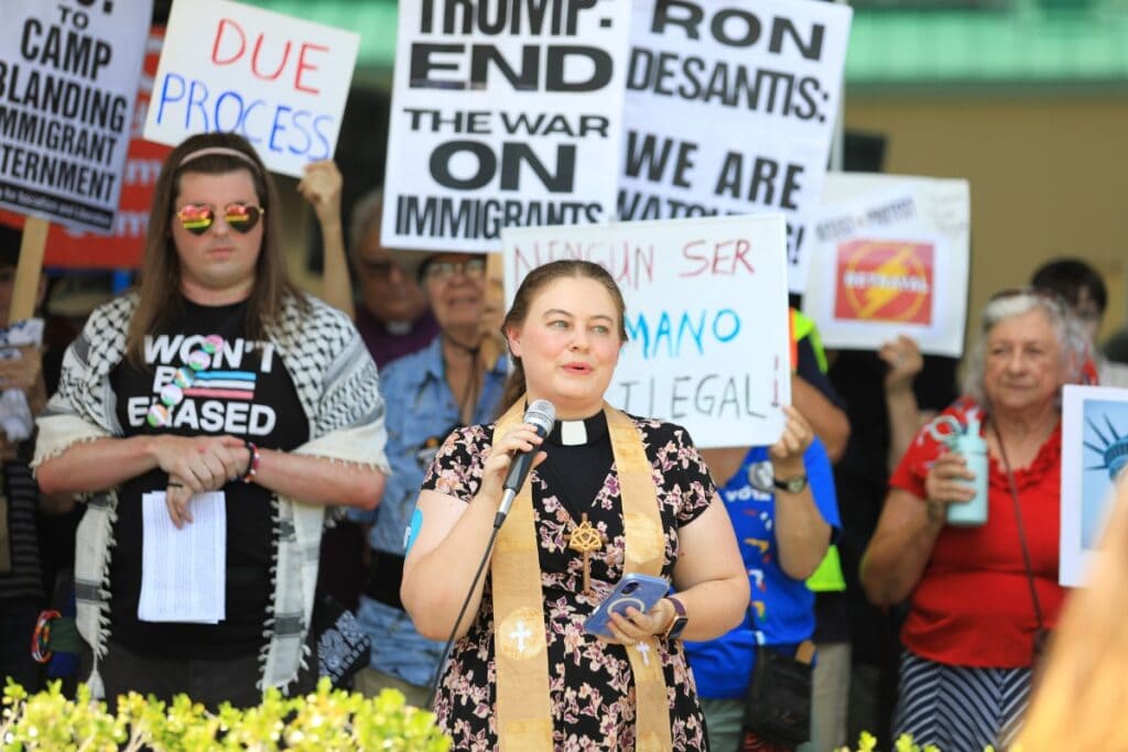 Rev. Becca Putman with Westminster Presbyterian Church spoke at the U.S. District Courthouse in Gainesville on Friday during a rally opposing immigrant detention centers in Florida. Photo by Seth