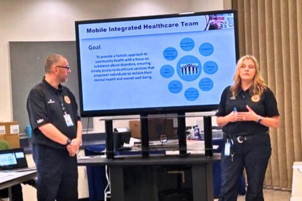 Bill Nice (left) and Capt. Jody Benware of Alachua County Fire Rescue give a presentation at the SNC meeting. Photo by Ronnie Lovler