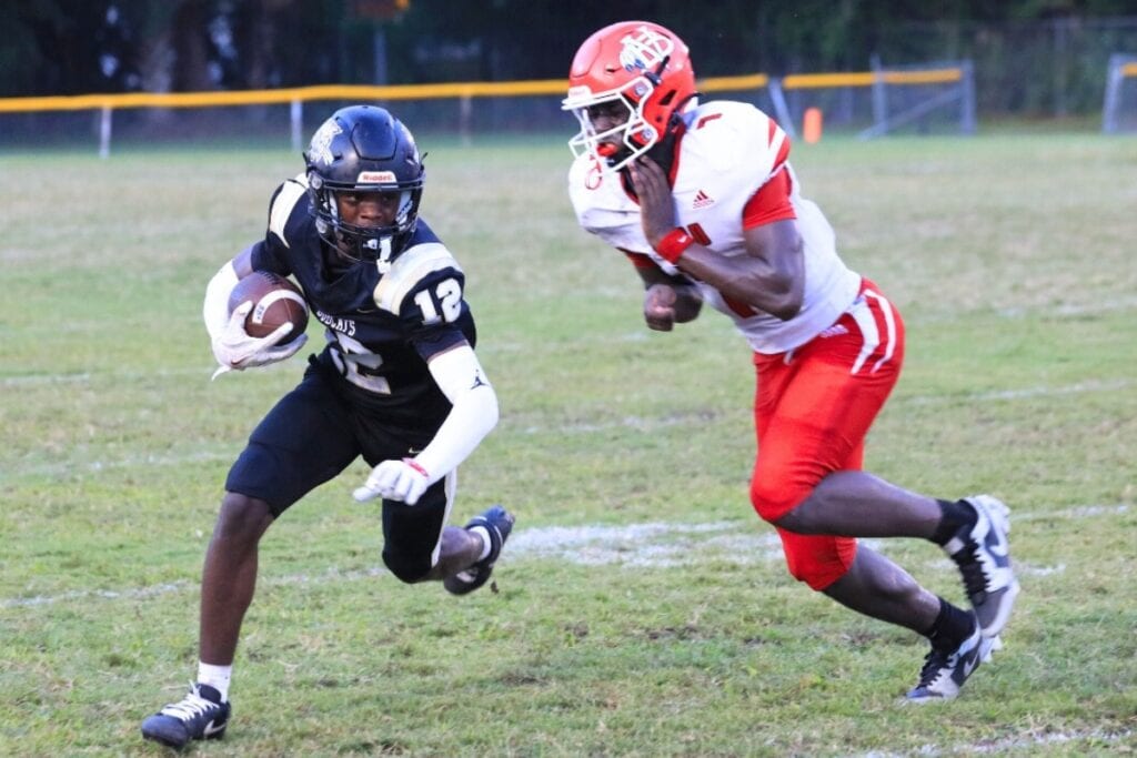 Buchholz's Marquel Brooks is shoved out of bounds after a catch against Vero Beach. Photo by Seth Johnson