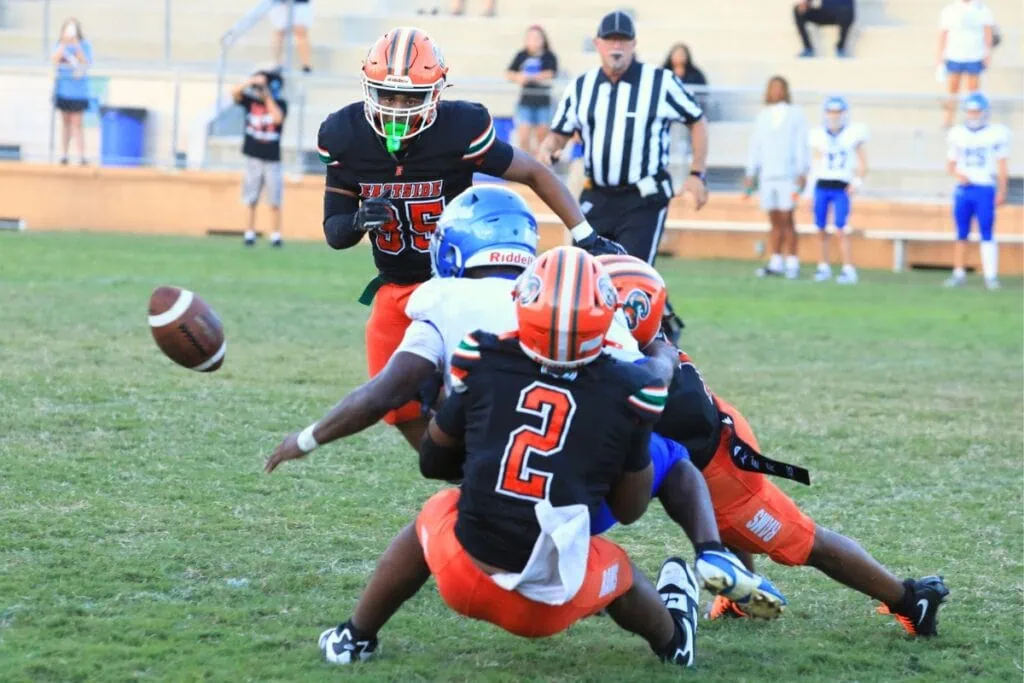 Eastside defenders force a turnover against Belleview in the first quarter, leading to the first touchdown of the game. Photo by Seth Johnson