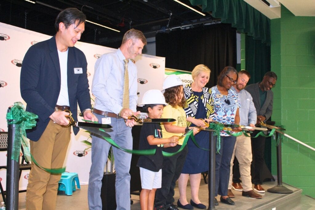 Representatives from Littlewood Elementary School, Alachua County Public Schools, the School Board of Alachua County, Parrish McCall and PBK Architects cut the ribbon on Friday morning.