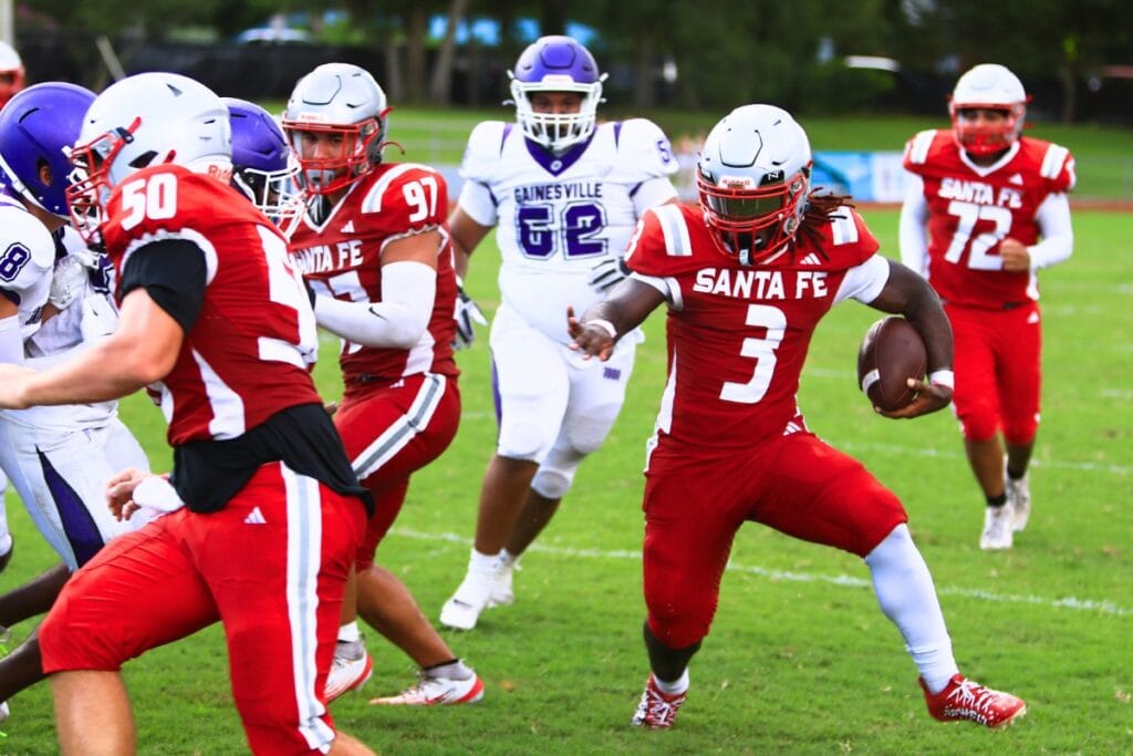 Santa Fe's Jasiah Powell with a first-quarter run against Gainesville on Thursday. Photo by C.J. Gish