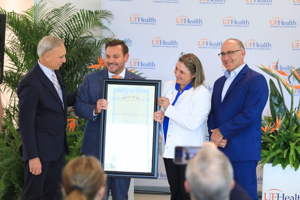 State Rep. Adam Anderson presents a signed copy of House Bill 907 which created the Sunshine Genetics Consortium. Photo by Seth Johnson