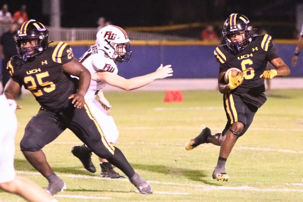 Union County's Clifton Ivey (25) and Drew Simmons (6) return on offense for the Tigers. Photo by C.J. Gish