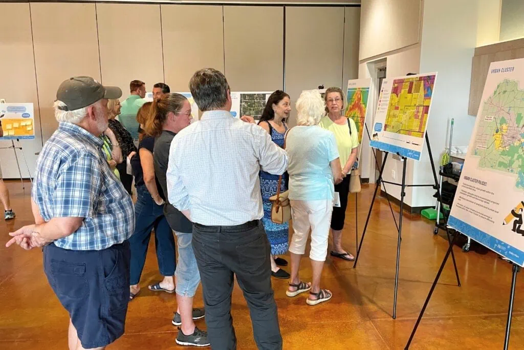 Attendees at Alachua County's public workshop gathered around informational boards to learn about the project and provide feedback.