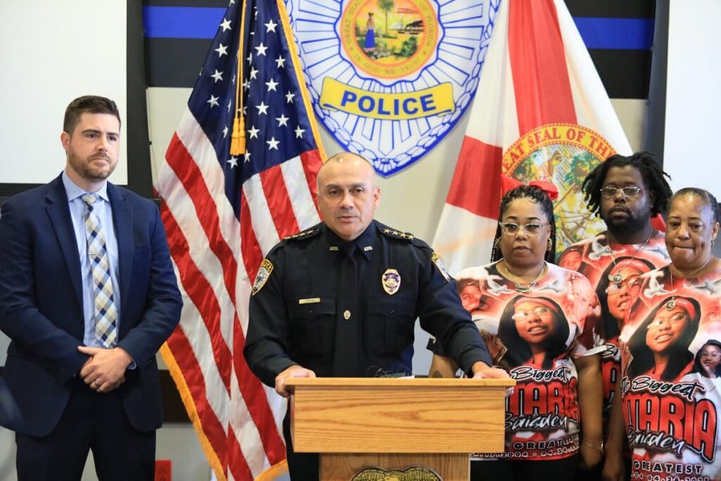 GPD Chief Nelson Moya announced the arrest of three men as part of the Easter shooting investigation. He's joined by Detective Cpl. Matt Quinn (left) and Ontaria Baisden's mother and grandmother along with another victim of the shooting (left).