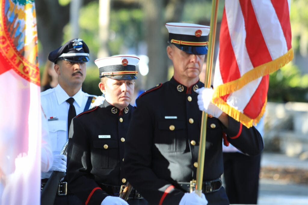 A joint honor guard of Gainesville police and fire members present the flags at a ceremony remembering the Sept. 11, 2001, attacks. Photo by Seth Johnson