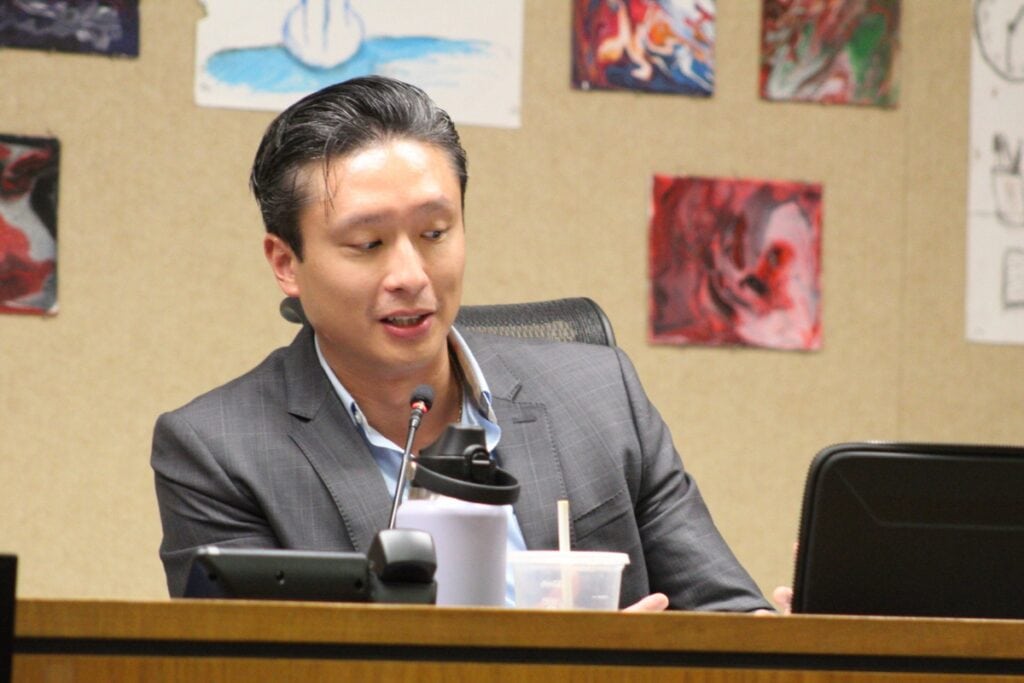 Board member Thomas Vu made the motion to adopt three policy changes Tuesday night. Photo by Nick Anschultz