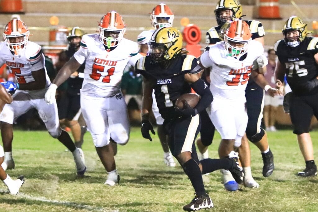 Buchholz's Chris Johnson (1) with a run against Eastside. Photo by C.J. Gish