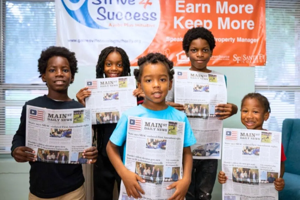 (From left) GHA junior newspaper deliverers Zion McGee, Aleiya Murray, Derrick Singleton, Kaeden Murray and Zydarius Thomas. Photo by Tim Rodriquez