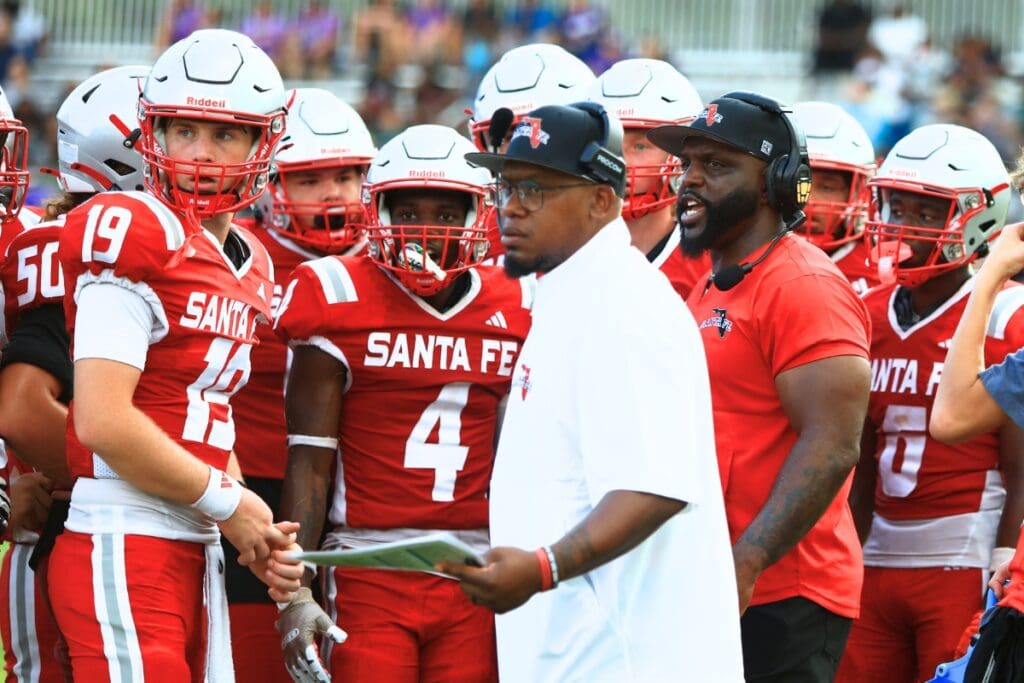 Santa Fe (Alachua) first-year coach Ernest Graham (red shirt) has the Raiders at 2-0 for the first time since 2014. Photo by C.J. Gish