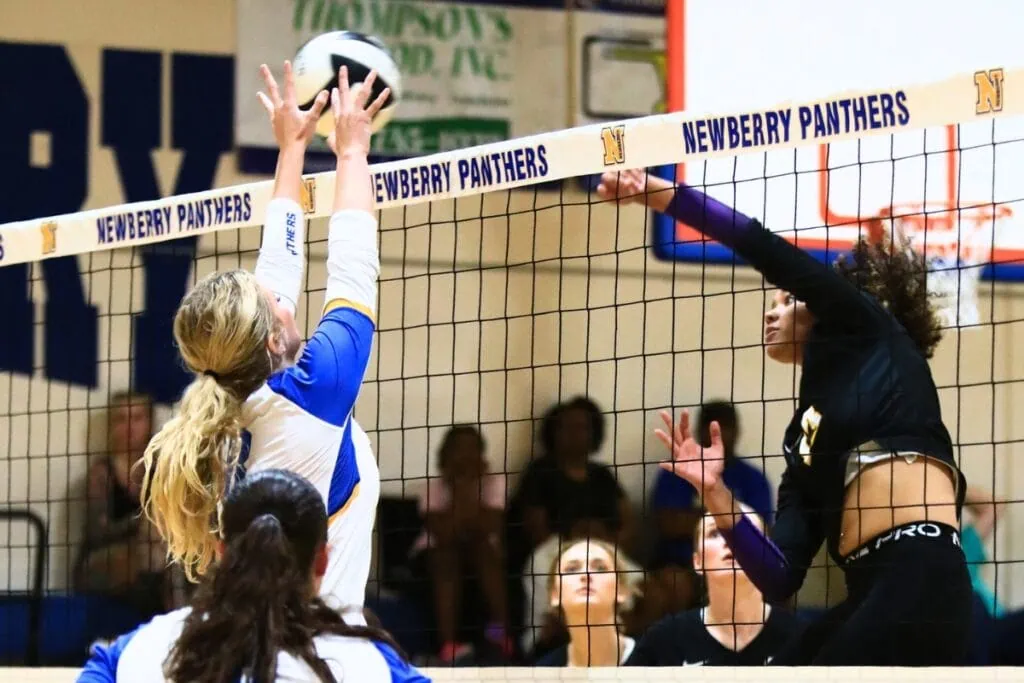 Union County's Jailyn Simmons (13) with a hit against Newberry's Livi Clanton. Photo by C.J. Gish