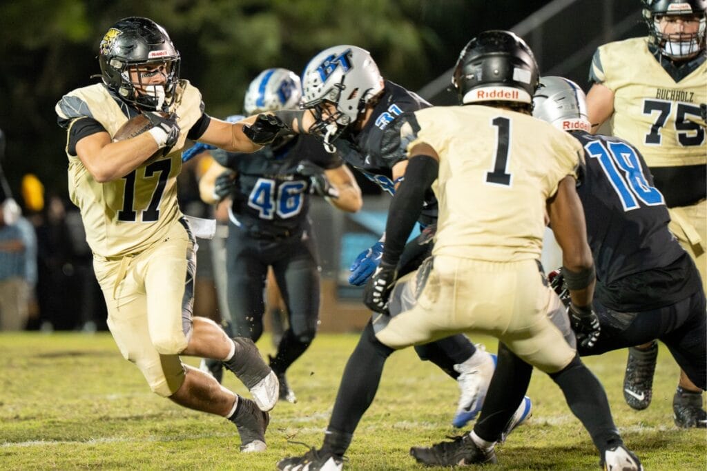 Buchholz's Ashton Norris attempts to dodge a Bartram Trail (St. Johns) defender. Photo by Tim Rodriquez
