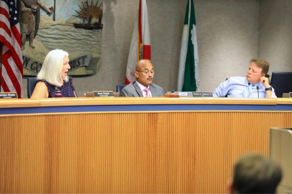 Commissioner Anna Prizzia (left) speaks at Alachua County's October 14 meeting with commissioners Chuck Chestnut (center) and Ken Cornell (right). Photo by Seth Johnson