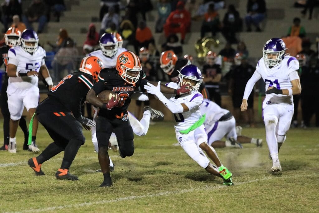 Eastside's Javaris Gardner stiff arms a GHS defender on a run.