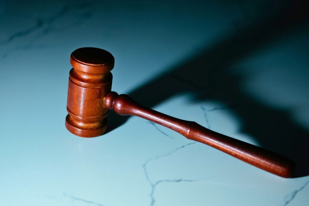 Gavel. Photo by Wesley Tingey-unsplash
