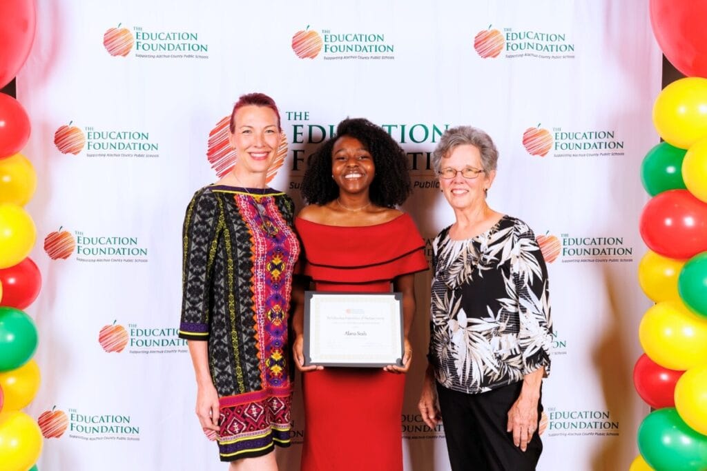 Santa Fe High School's Alana Seals (center) was the 2025 recipient of the Alachua Business League Scholarship. Courtesy of EFAC