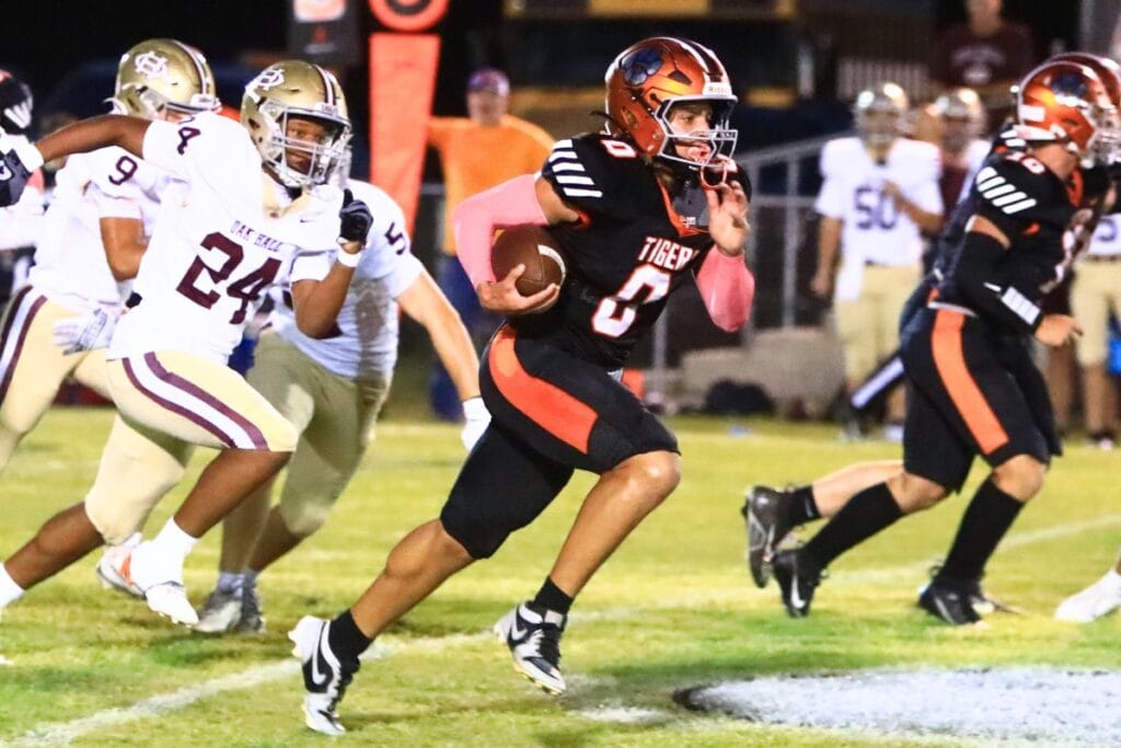 Trenton's Alexzander Henry (0) with a first-quarter touchdown run against Oak Hall. Photo by C.J. Gish