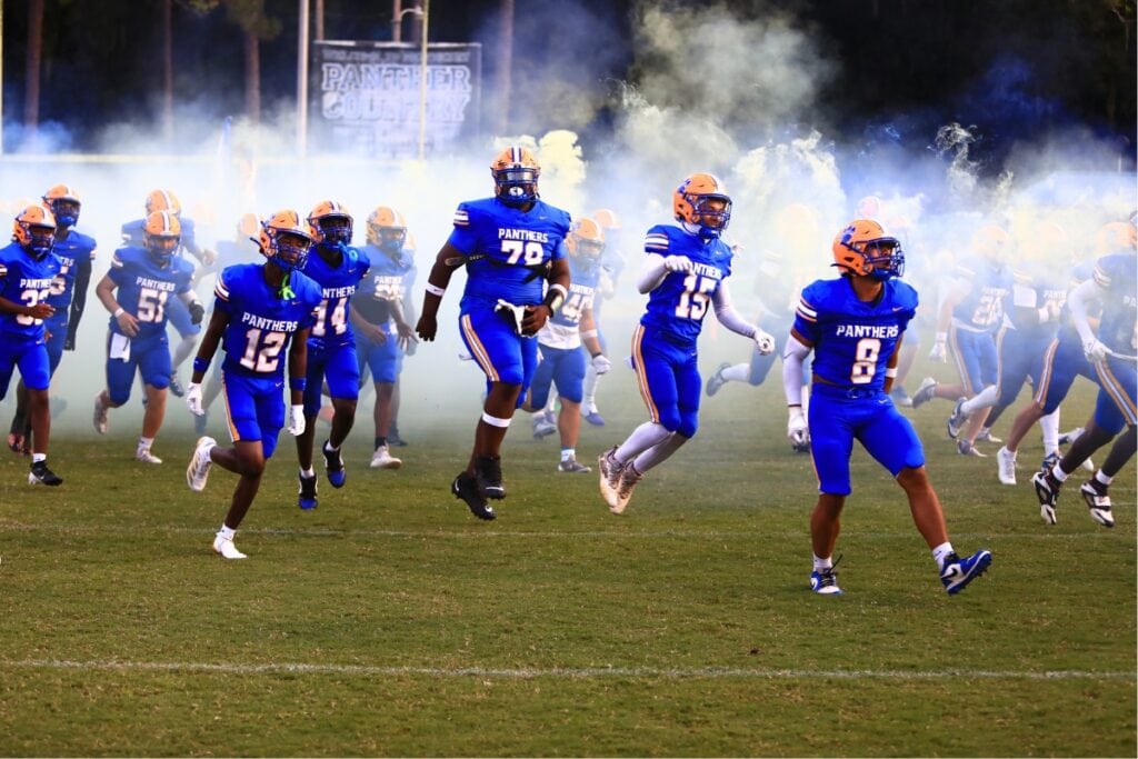 Newberry High School players take the field ahead of a game against Hawthorne.