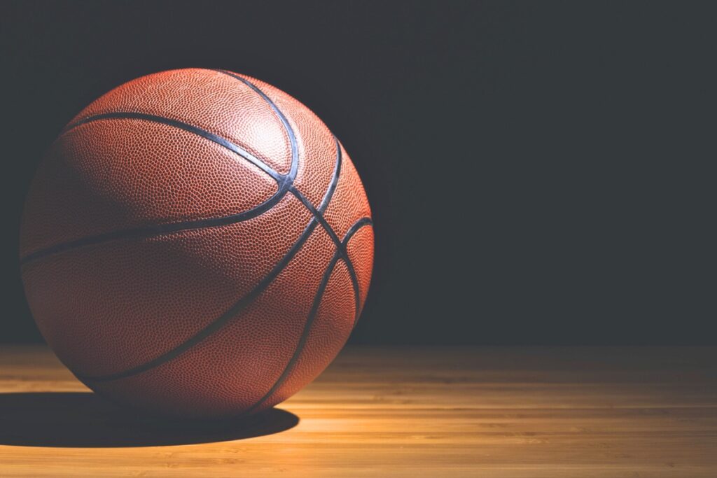 Basketball on side of court. Metro Creative