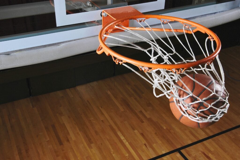 Basketball through hoop. Metro Creative