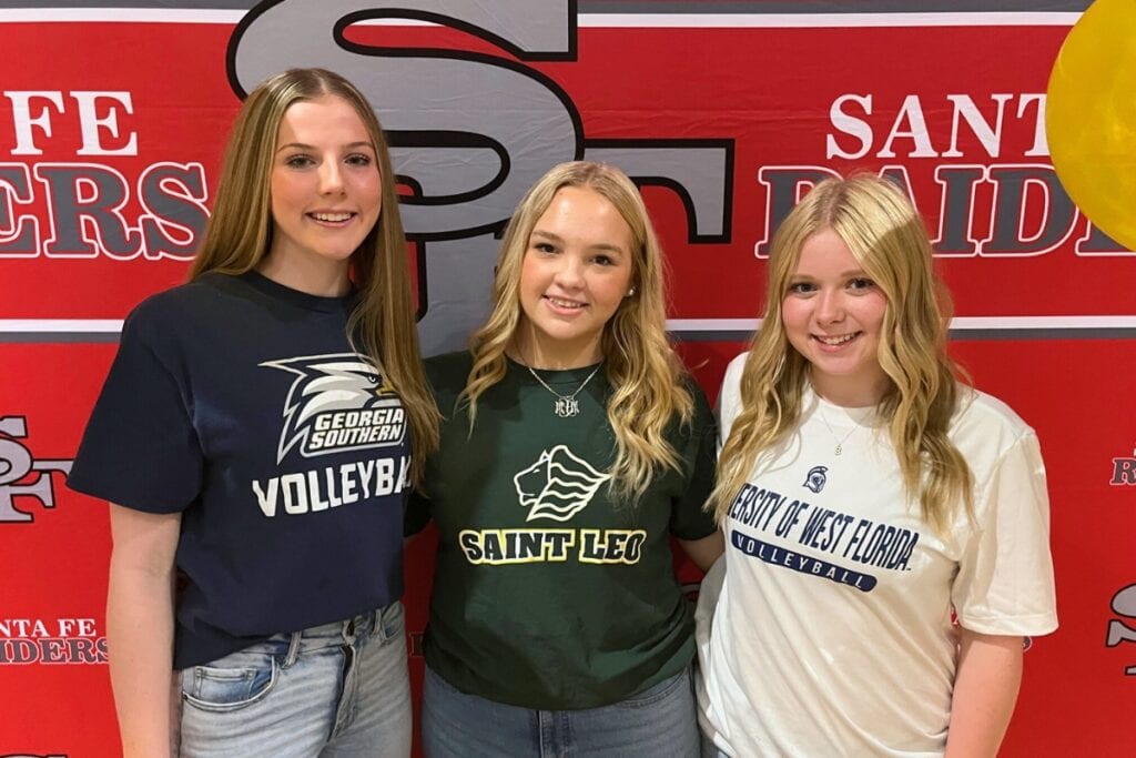(From left) Santa Fe's Delaney Wingenbach, Morgan Lawson and Gracyn Marshall signed to play volleyball collegiately on Friday. Photo by Mike Ridaught