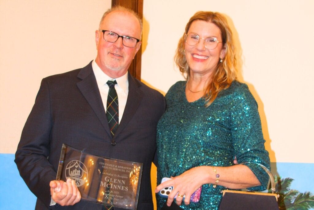 Glen McInnes (left) was presented with an award on Nov. 13 for his volunteer efforts with CDS. Photo by Isabela Ochoa