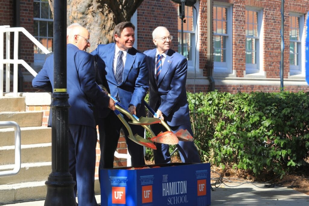 Gov. Ron DeSantis (center), UF interim President Donald Landry (right) and Justice Charles Canady (left) break ground of the Hamilton School. Photo by Seth Johnson