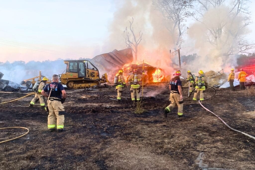Multiple fire agencies responded to a wildland fire in southwest Alachua County on Wednesday afternoon and extinguished a blaze that involved a barn containing hay. Courtesy of ACFR