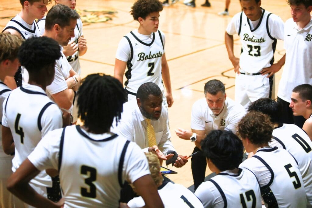 Buchholz coach Elliot Harris (in tie) and the Bobcats will be one of the many teams playing holiday basketball tournaments. Photo by C.J. Gish